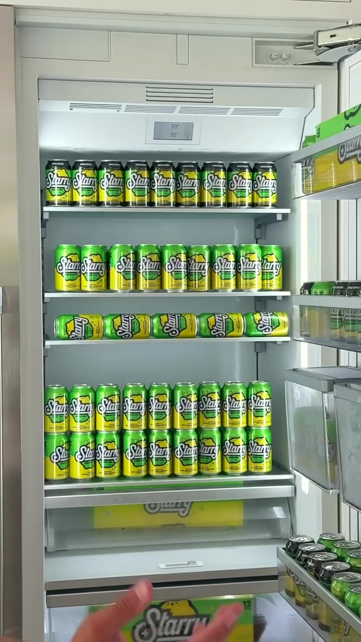 TikTok post by @thedombrack for Starry. Caption reads: #starrypartner Turned his fridge into a 10/10....