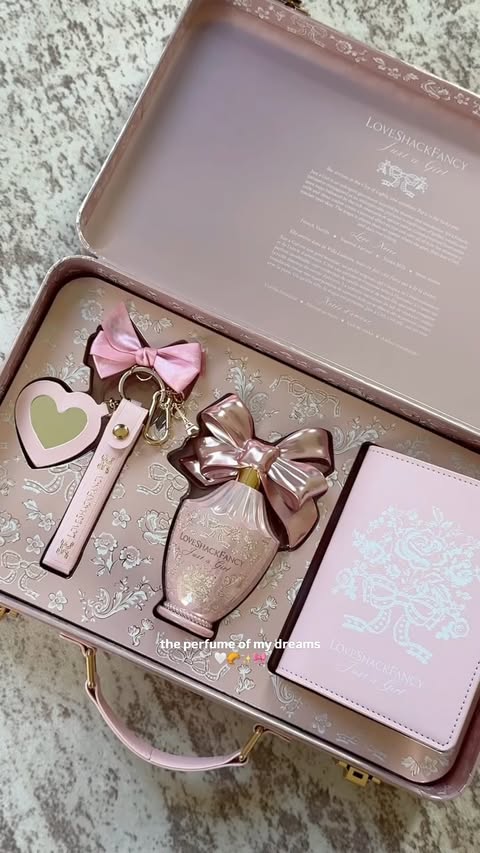 Instagram post by @l0vemarisa for LoveShackFancy. Caption reads: @loveshackfancy new “just a girl” perfume 🎀 Key....
