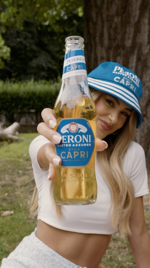 Instagram post by @joannachimonides for Peroni Nastro Azzurro. Caption reads: #AD | The sun is out and it’s only right to....