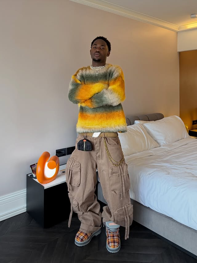 Instagram post by @juniorsimo_ for boohooMAN. Caption reads: sunday vibe 🧡🔥
@boohoomanofficial 

#streetwear....