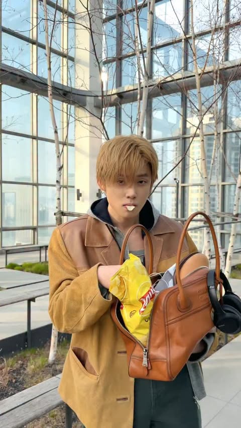 Instagram post by @yawnzzn for Miu Miu. Caption reads: just a big bag kinda day @MiuMiu #MiuMiu....