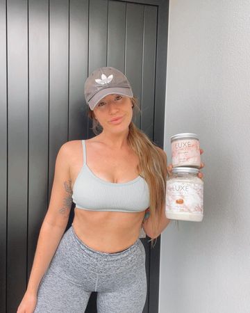 Instagram post by @carmenstimpson for LUXE Fitness. Caption reads: [...] that loves sweating during a workout.....