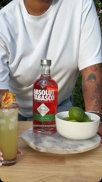 Instagram post by @lexie.louuuuu for Absolut. Caption reads: [...] just got a whole lot swicier with ABSOLUT....