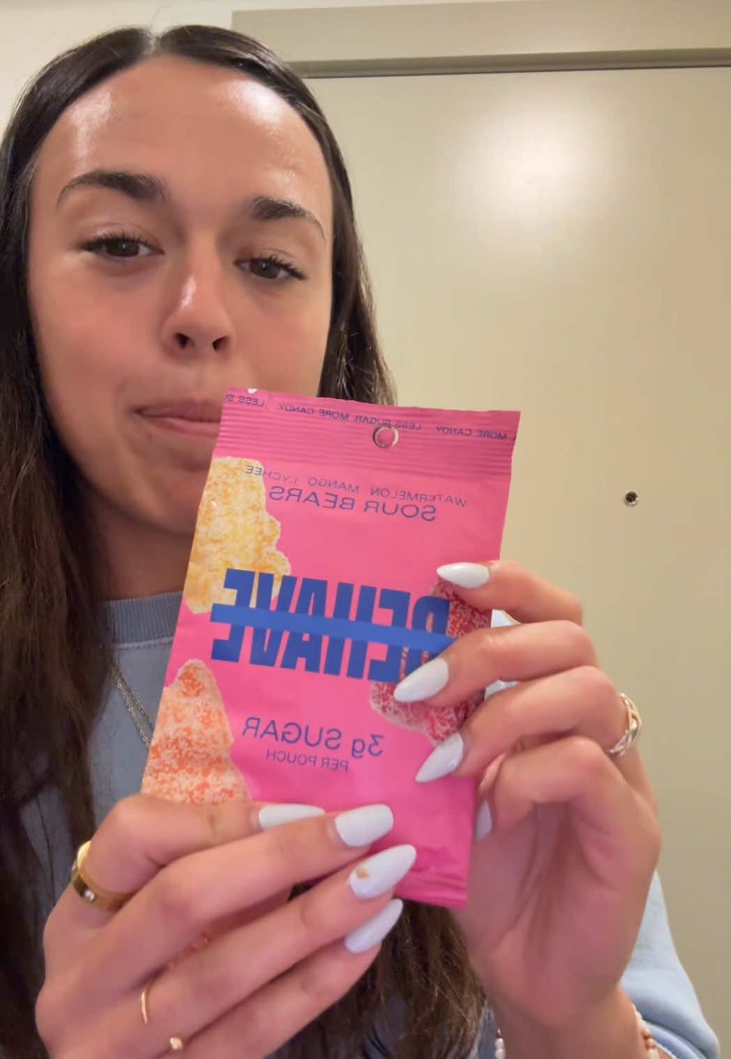 TikTok post by @emilykinsfather for BEHAVE. Caption reads: these are so good!! @BEHAVE Candy #foryou #gummies....