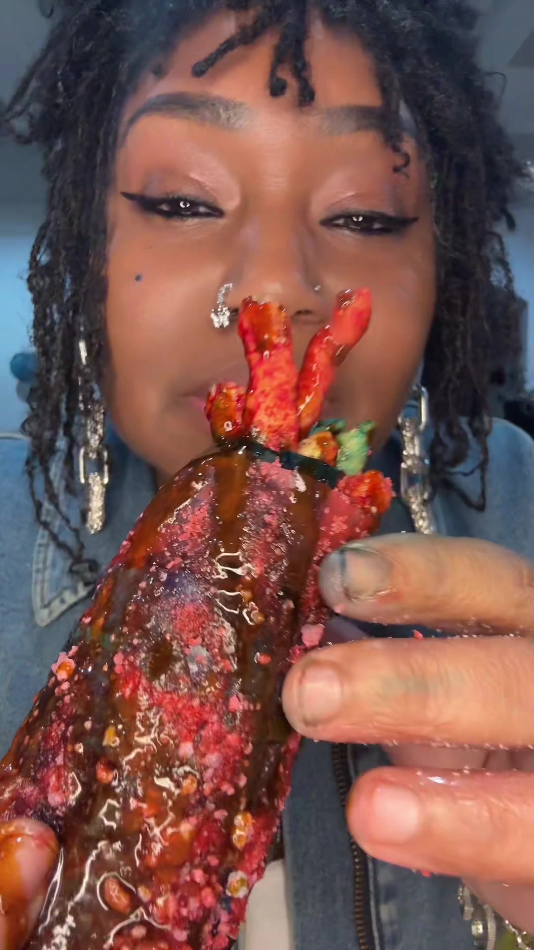 TikTok post by @bloveslife for Sourboy Snacks. Caption reads: Cotton Candy Pickle Mukbang @sourboychamoy....