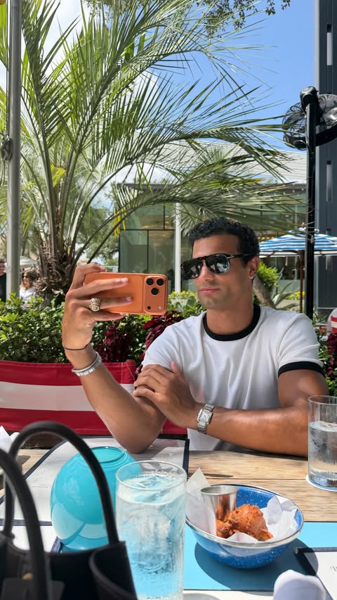 Instagram post by @tylervanwag for Versace. Caption reads: morning from home @versace #versacefrangrances #ad....