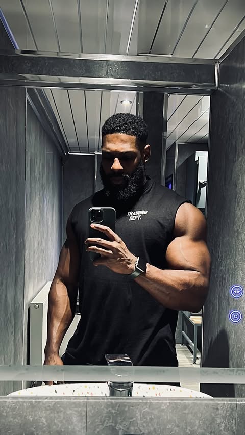 Instagram post by @malikspencerfitness for boohooMAN. Caption reads: Better than yesterday 🤞🏿

@boohoomanactive....