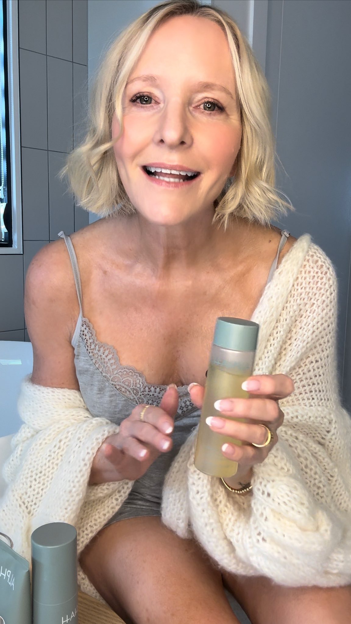 Instagram post by @howtwostyle_midlife for ALPHA-H. Caption reads: When I find products that treat my body with the....