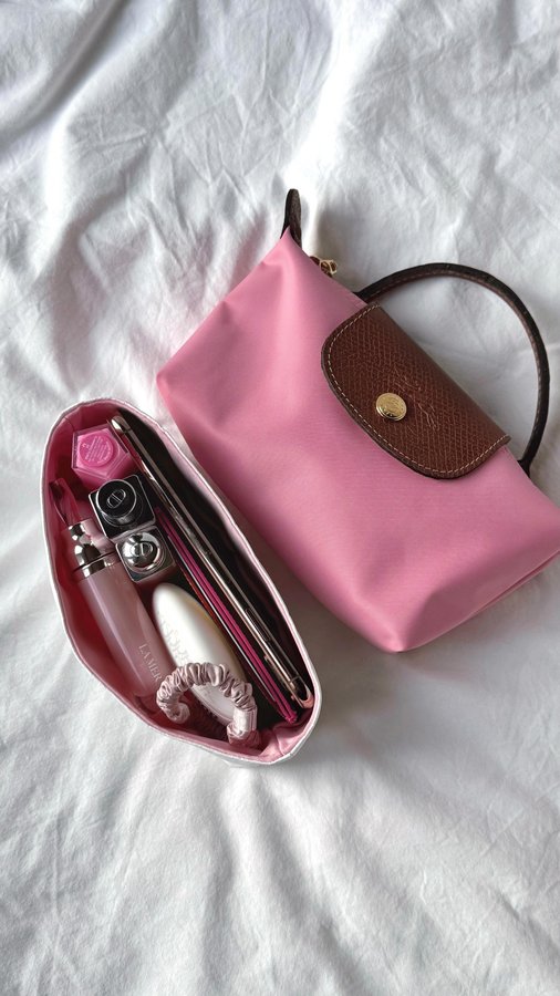 Instagram post by @fromsandyxo for SLIP SILK PILLOWCASE. Caption reads: Add an organiser to my Longchamp pouch with me....