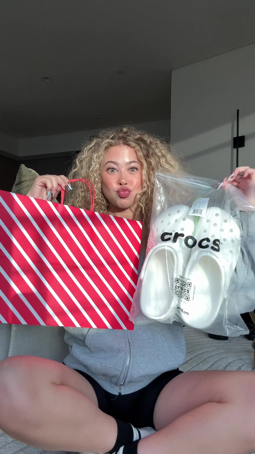 TikTok post by @maliaelaine for Crocs. Caption reads: spend the perfect festive day with me to kick off....
