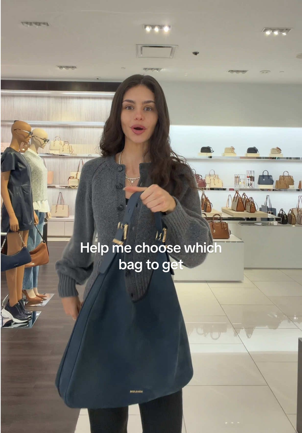 TikTok post by @kirakirbyy for Michael Kors. Caption reads: [...] this mall pls lmk asap!! Also hi didn't know....