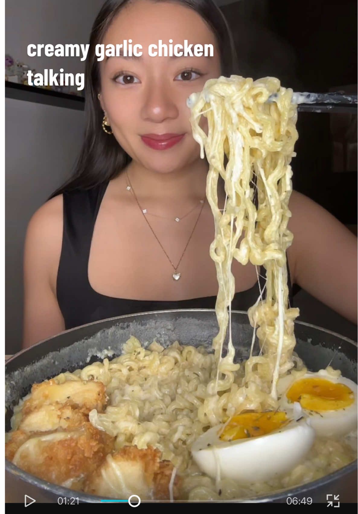 TikTok post by @sarah.slurps for Nongshim America. Caption reads: 🍗 Creamy garlic chicken ramen mukbang with boiled....