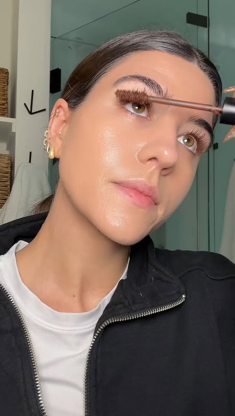 Instagram post by @aly_schmitt for OSEA Malibu. Caption reads: YSL brown mascara >>> 
@yslbeauty 
#asmr #grwm....