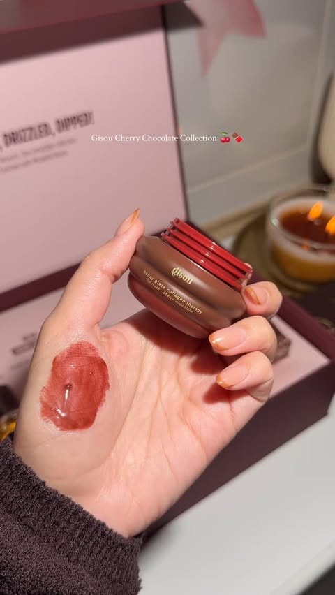 Instagram post by @makeupbykay_19 for Gisou. Caption reads: [...] new cherry chocolate collection from @gisou....