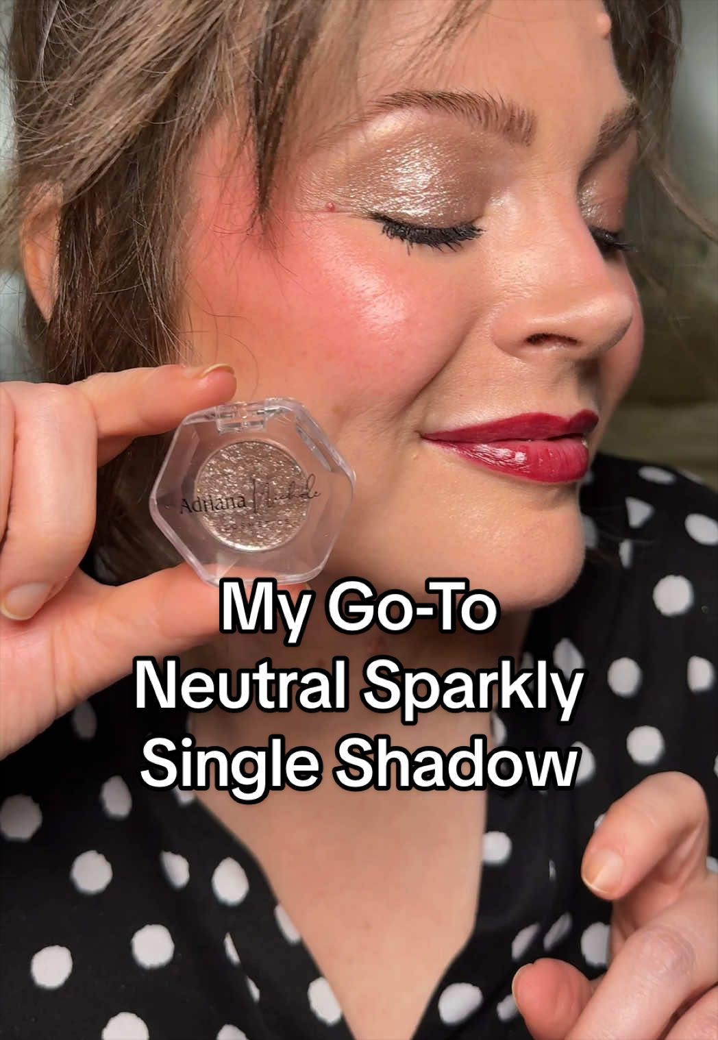 TikTok post by @melissa_beautyover40 for Adriana Nichole Cosmetics. Caption reads: [...] red lipstick is Queen from @Adriana Nichole....