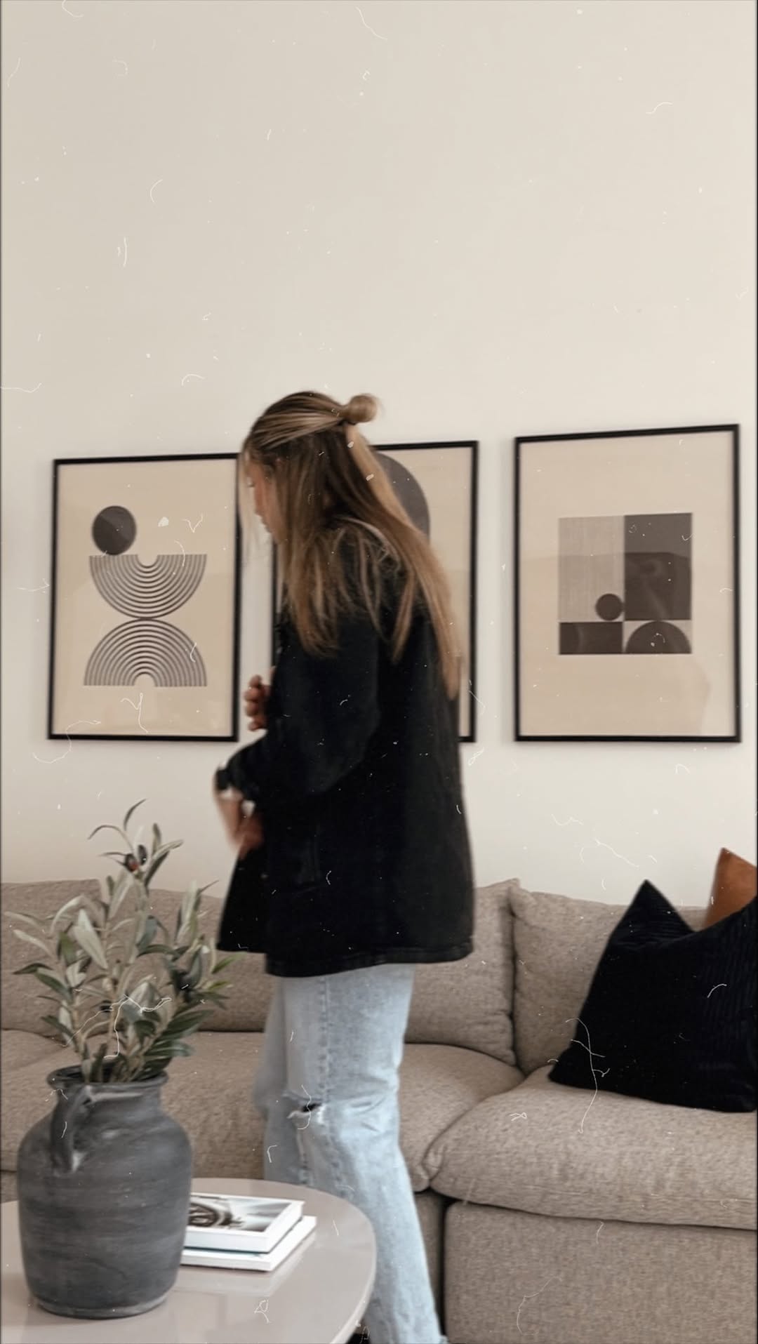 Instagram post by @danicachateauneuf for Opposite Wall. Caption reads: the perfect finishing touches for our living room....