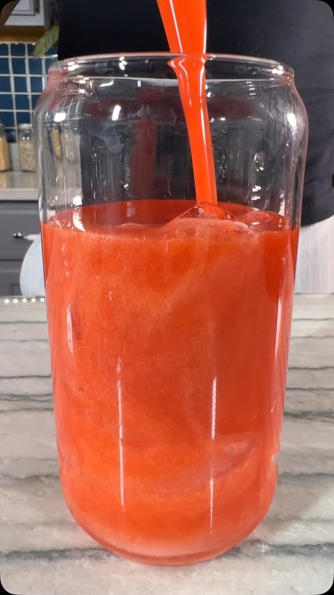 Instagram post by @healthyveganeating for Kuvings. Caption reads: [...] ⬇️ Strawberry Lemonade #ad I’m using my....