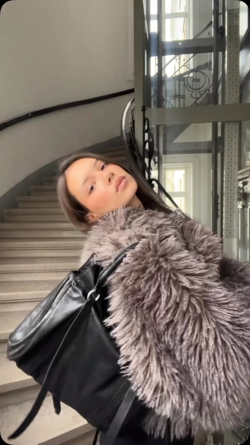 Instagram post by @lou.ava.rose for Monki. Caption reads: Only love for this coat @monki #ad.