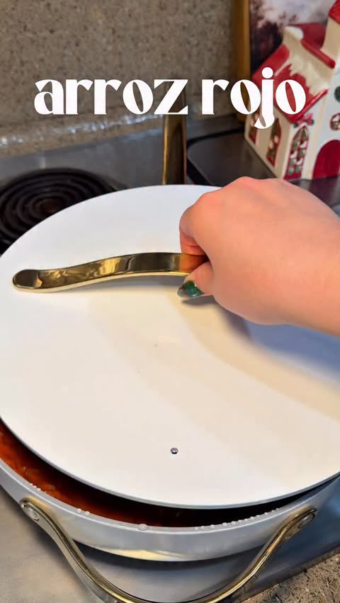 Instagram post by @glamabellecooks for Caraway Home. Caption reads: the most easy and delicious arroz rojo 😋🍅🍚....