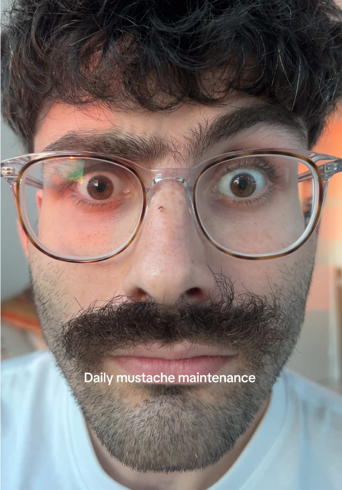 TikTok post by @david.yusupov for Death Grip Wax. Caption reads: This is how to tame your mustache @Death Grip Wax....