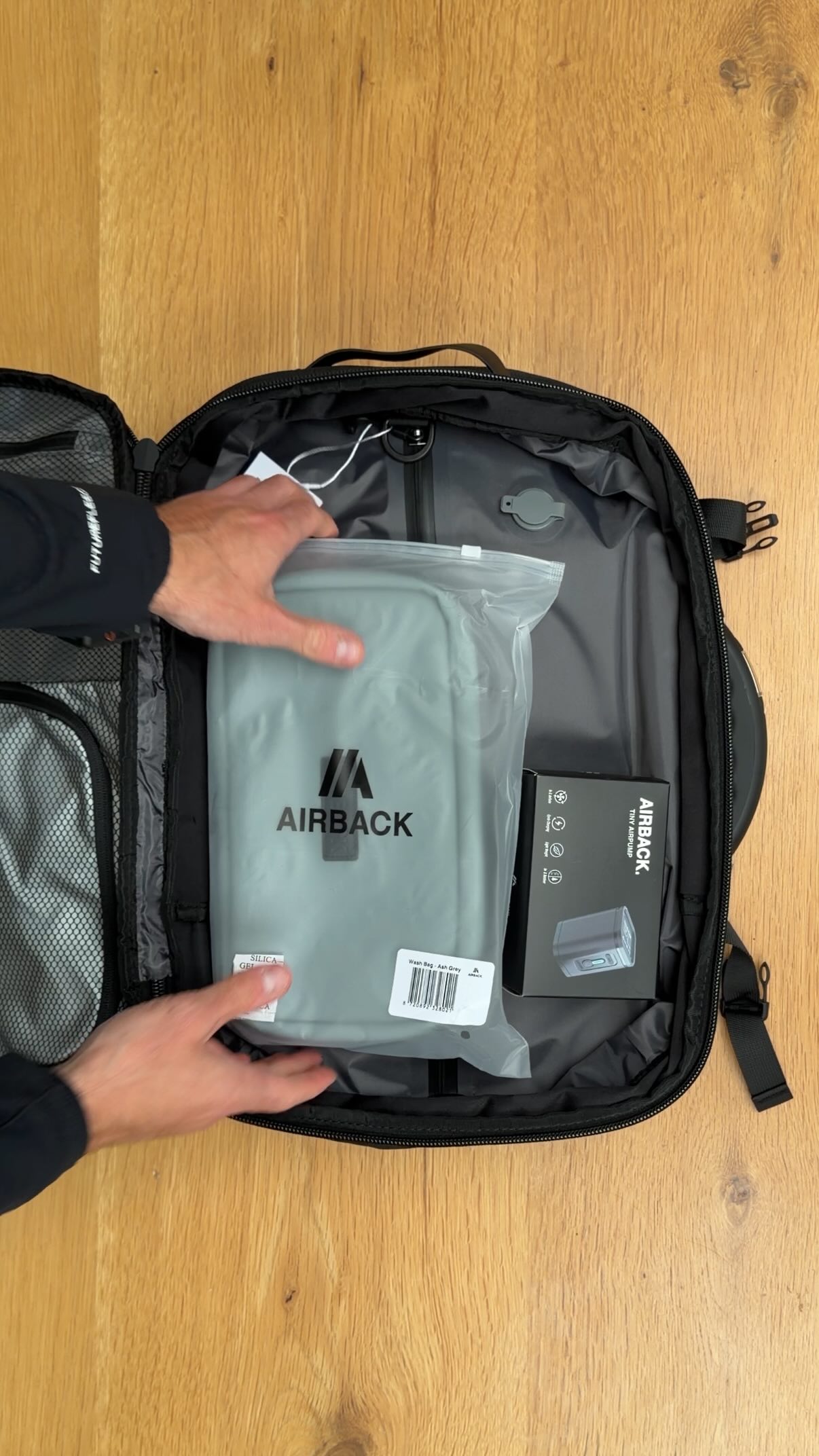 Instagram post by @joshbeaumontt for Airback. Caption reads: ASMR Packing with the Airback Original Ash Grey🔥....