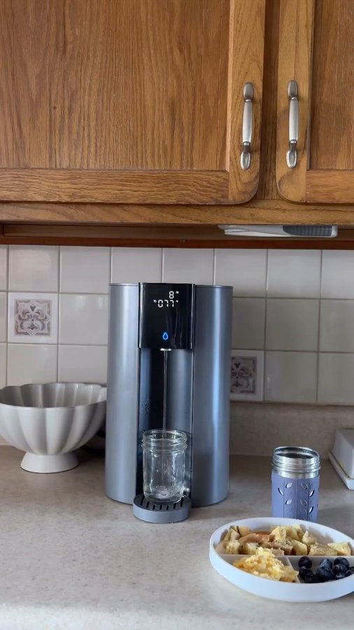 Instagram post by @thetaymagruder for Waterdrop Filter. Caption reads: Give the gift that keeps on caring — for health,....