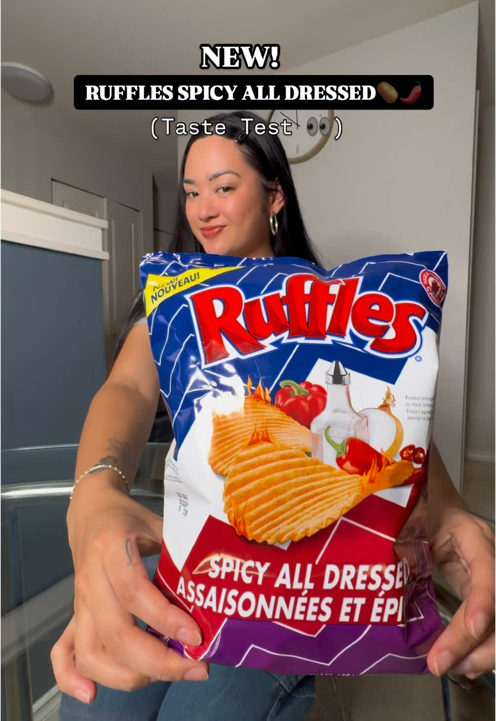 TikTok post by @yothatssobomb for Ruffles. Caption reads: TRYING new Ruffles Spicy All Dressed Chips! #AD....