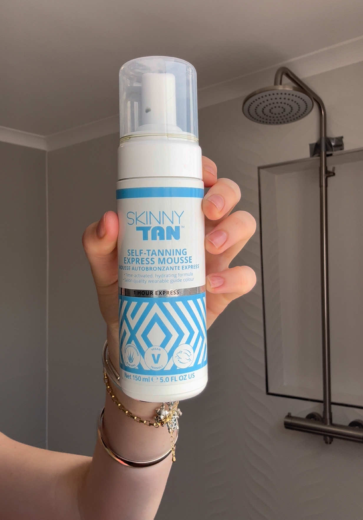 TikTok post by @tina_vanlingen for Skinny Tan. Caption reads: Tan from @Skinny Tan  Extreme Hydration from E45 ....