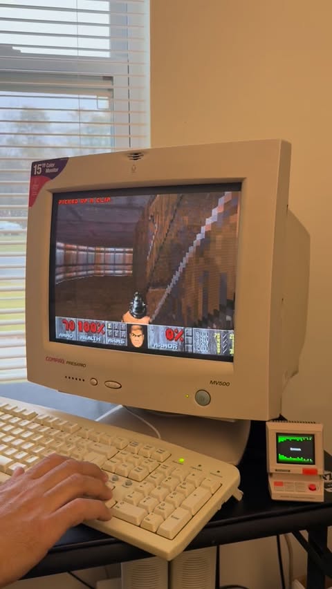 Instagram post by @retrocomputer_ for Divoom. Caption reads: [...] your day like a Doom demon slayer with....