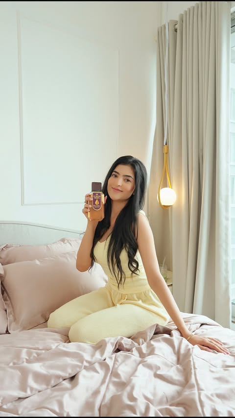 Instagram post by @snigdha_officiall for Bajaj Almond Drops. Caption reads: [...] one of them, and going back to Bajaj Almond....
