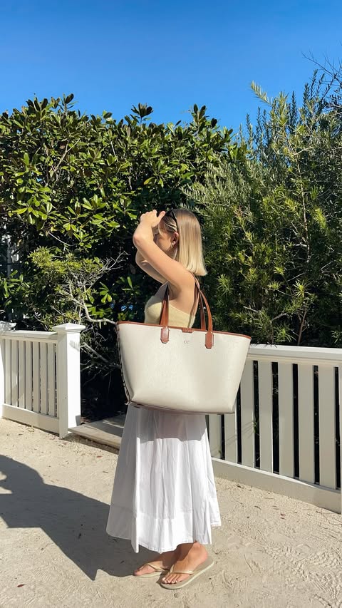 Instagram post by @cerecampbell for CALPAK. Caption reads: [...] it all in the Canvas Laptop Tote from....