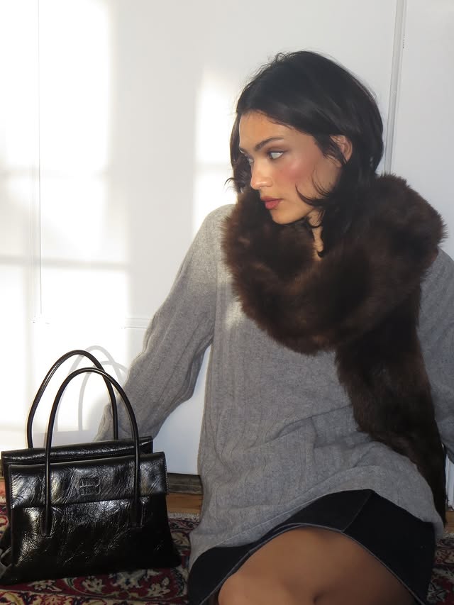 Instagram post by @yesly for Miu Miu. Caption reads: happy holidays from me and my @miumiu bag....