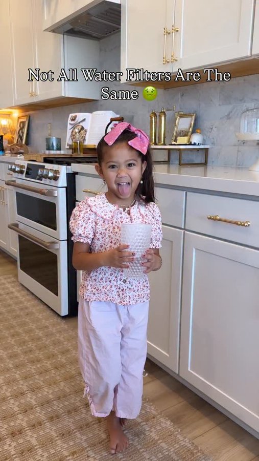 Instagram post by @hellopalmerfamily for Aquasana. Caption reads: Ever since we switched our drinking water water....