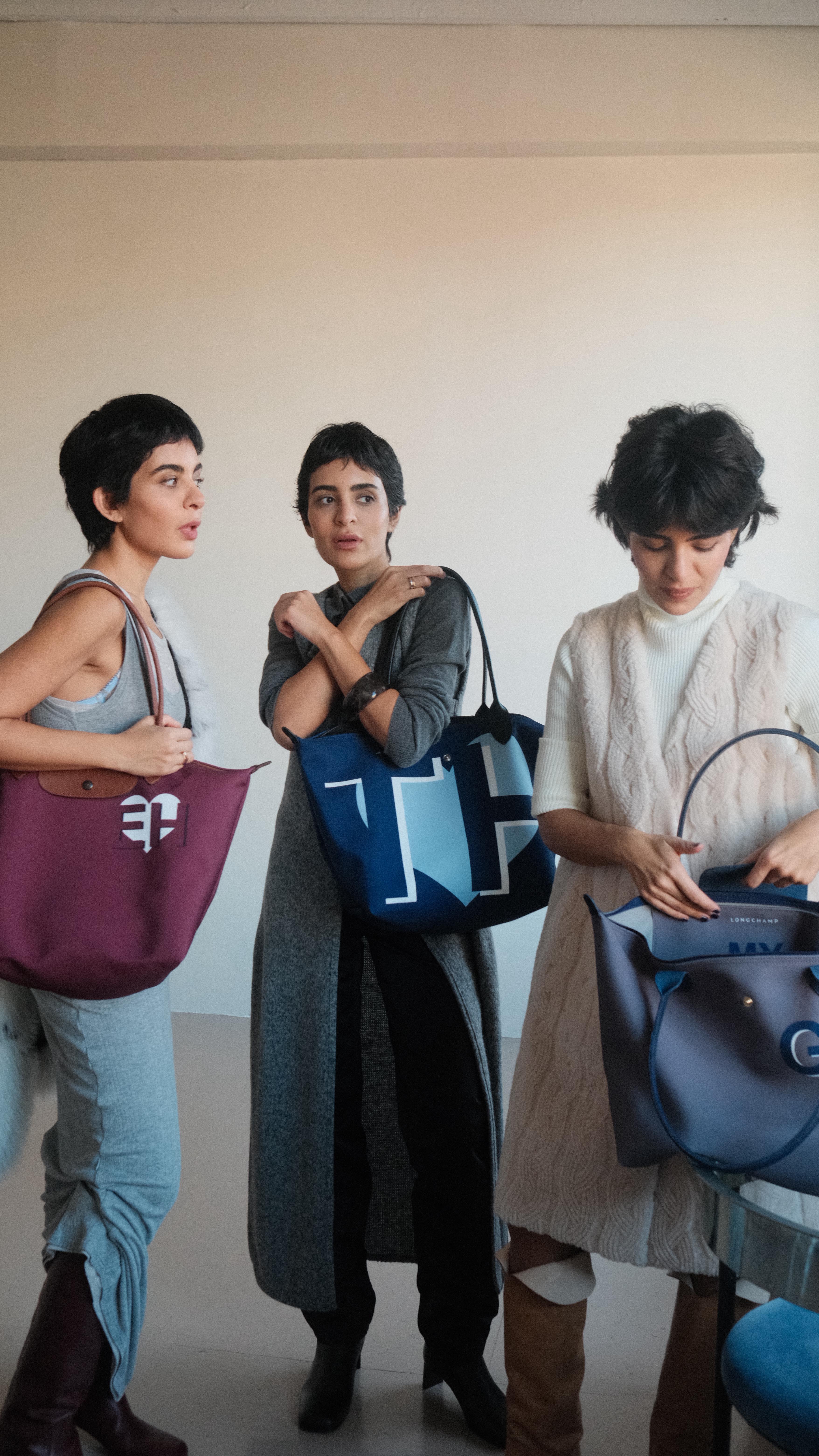 Instagram post by @thetripletsss for Longchamp. Caption reads: ad @longchamp My Pliage Signature bags....