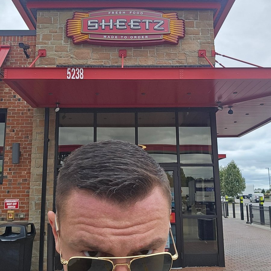 Instagram post by @femahiester for Sheetz. Caption reads: The military industrial complex and boom boom....