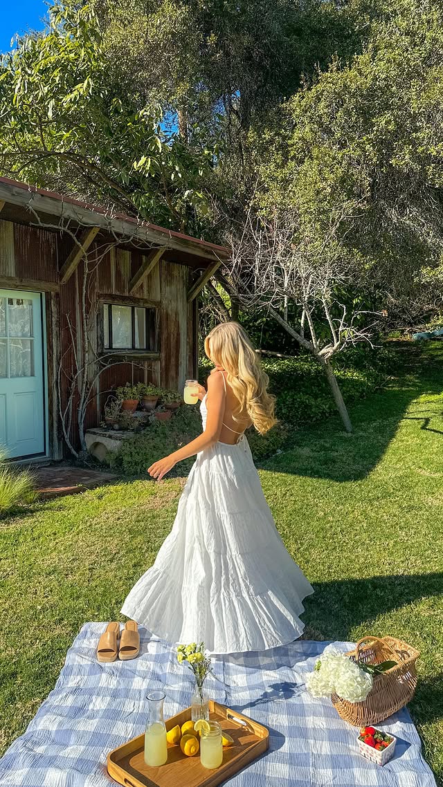 Instagram post by @solarpowered_blonde for Fortunate One. Caption reads: soaking in the sunshine ☀️ dress is....