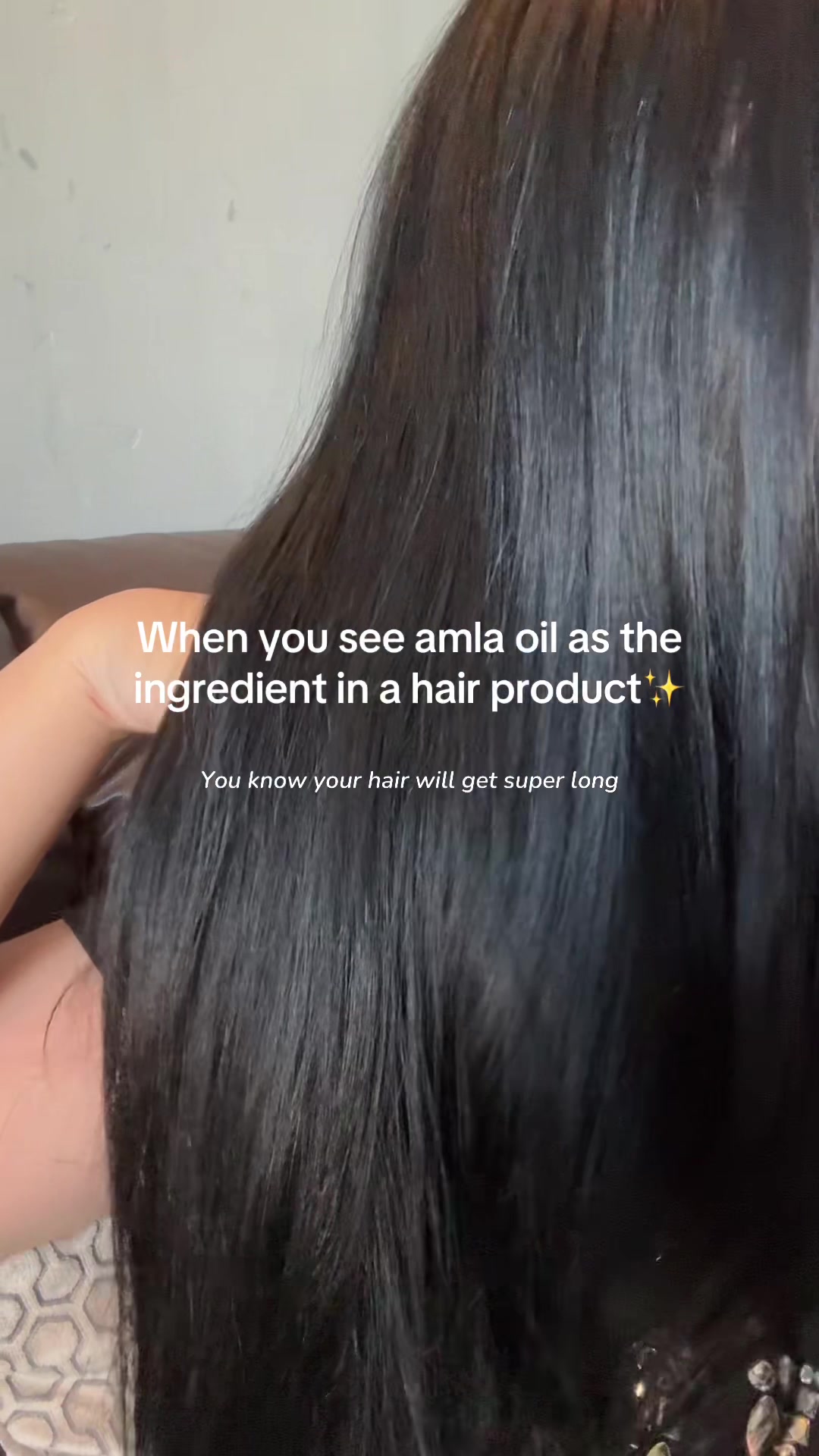 TikTok post by @bellebuys for Delhicious Body. Caption reads: #delhicioushairoil #amlaoil #rosemaryoil #haircare....