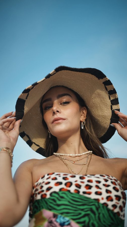 Instagram post by @serayozkan for Twist. Caption reads: Always summer spirit 🌞🌅🧡 w/ @twistturkiye....