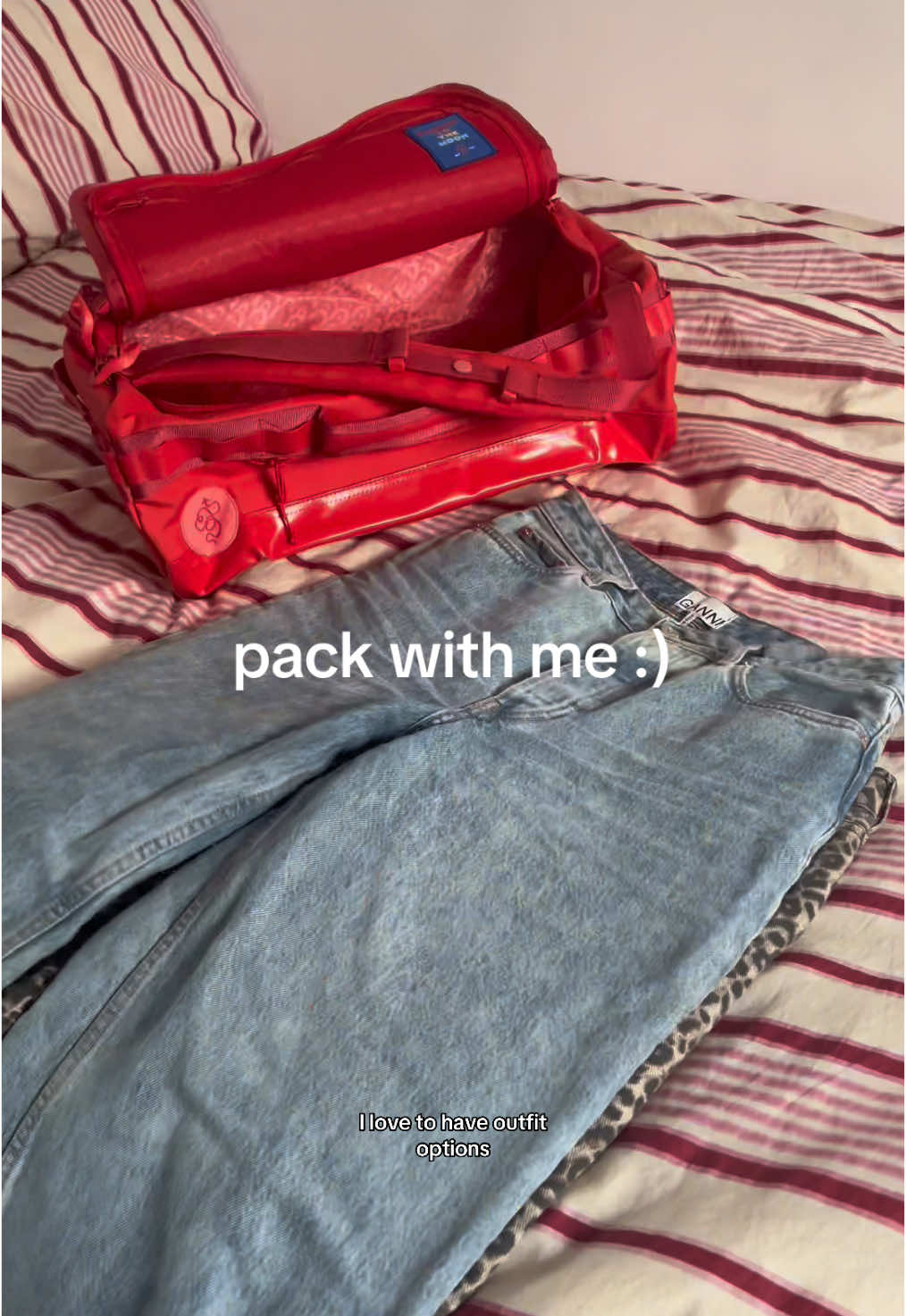 TikTok post by @a.lexakari for Baboon To The Moon. Caption reads: outfit options 🫡 @BABOON TO THE MOON go bag 💋 ....