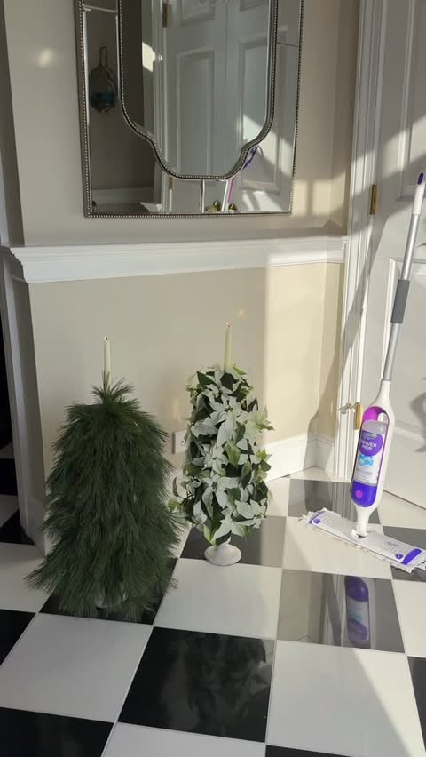 Instagram post by @flipdaddie for Swiffer. Caption reads: [...] - poinsettias, pine tree stems, and the....