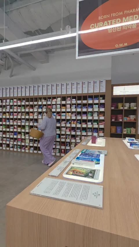 Instagram post by @hey.lucyyy_ for OWM Pharm. Caption reads: Optima Wellness Museum Pharmacy Itaewon Branch....