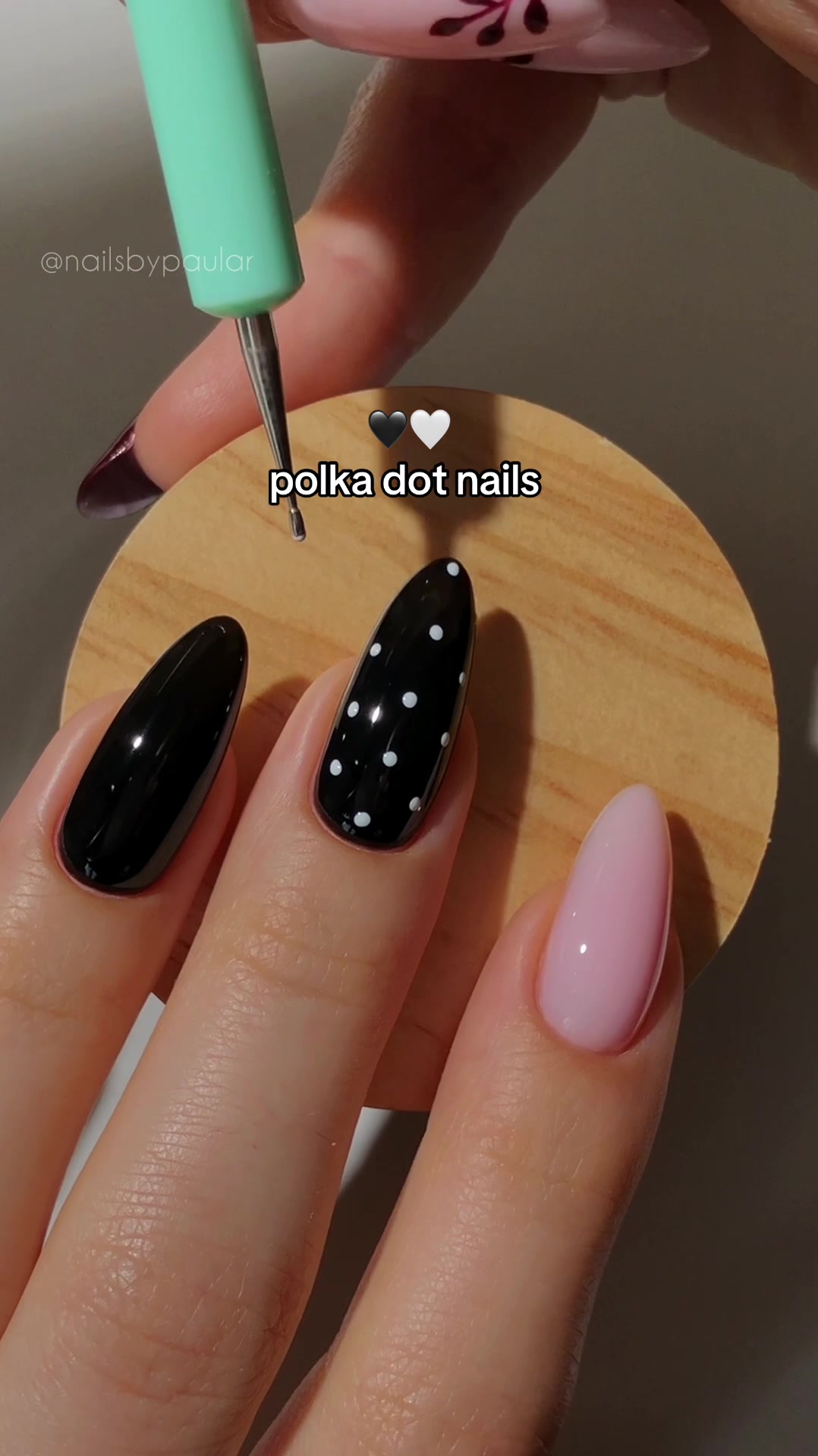 TikTok post by @nailsbypaular for MelodySusie. Caption reads: cute polka dot nails! 🖤🧸⚪️ polka dots have been....