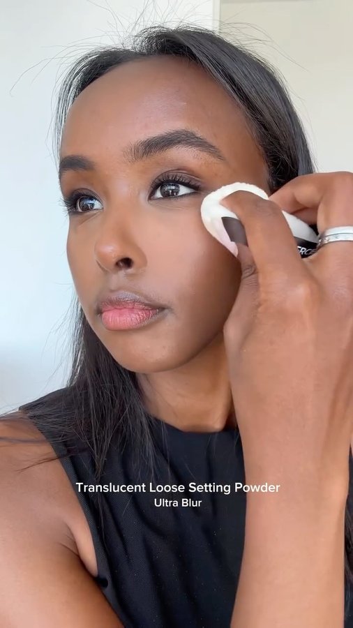 Instagram post by @emanosmann for Laura Mercier. Caption reads: My go-to holiday-party look, created using my....