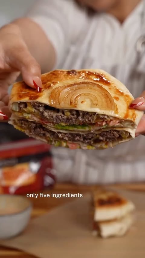 Instagram post by @hungrymockingbird for Sargento. Caption reads: #SargentoPartner Cheeseburger crunch wrap with a....