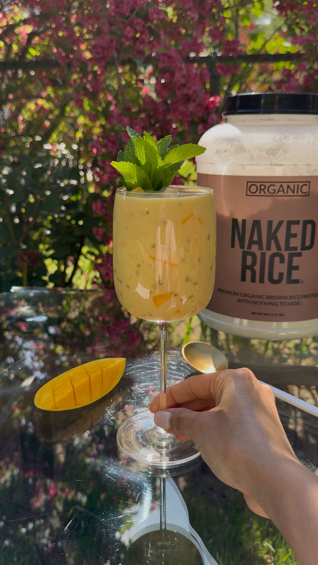 Instagram post by @lifestylebyanju for NAKED nutrition. Caption reads: [...] a refreshing touch. #ad #nakednutrition....
