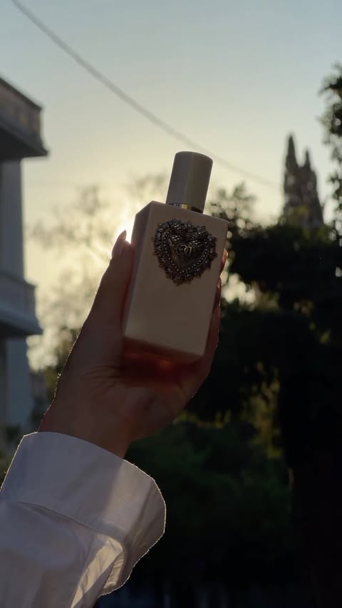Instagram post by @keisi.miziou for Dolce&Gabbana Beauty. Caption reads: #ad @dolcegabbana_beauty Your Devotion EDP Intense....