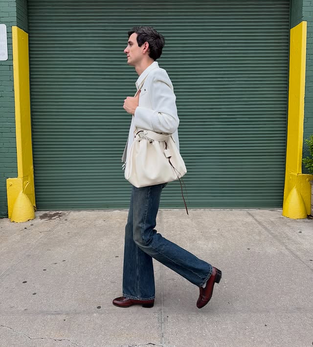 Instagram post by @elliotduprey for Songmont. Caption reads: [...] neighborhood strolling in NYC with the....