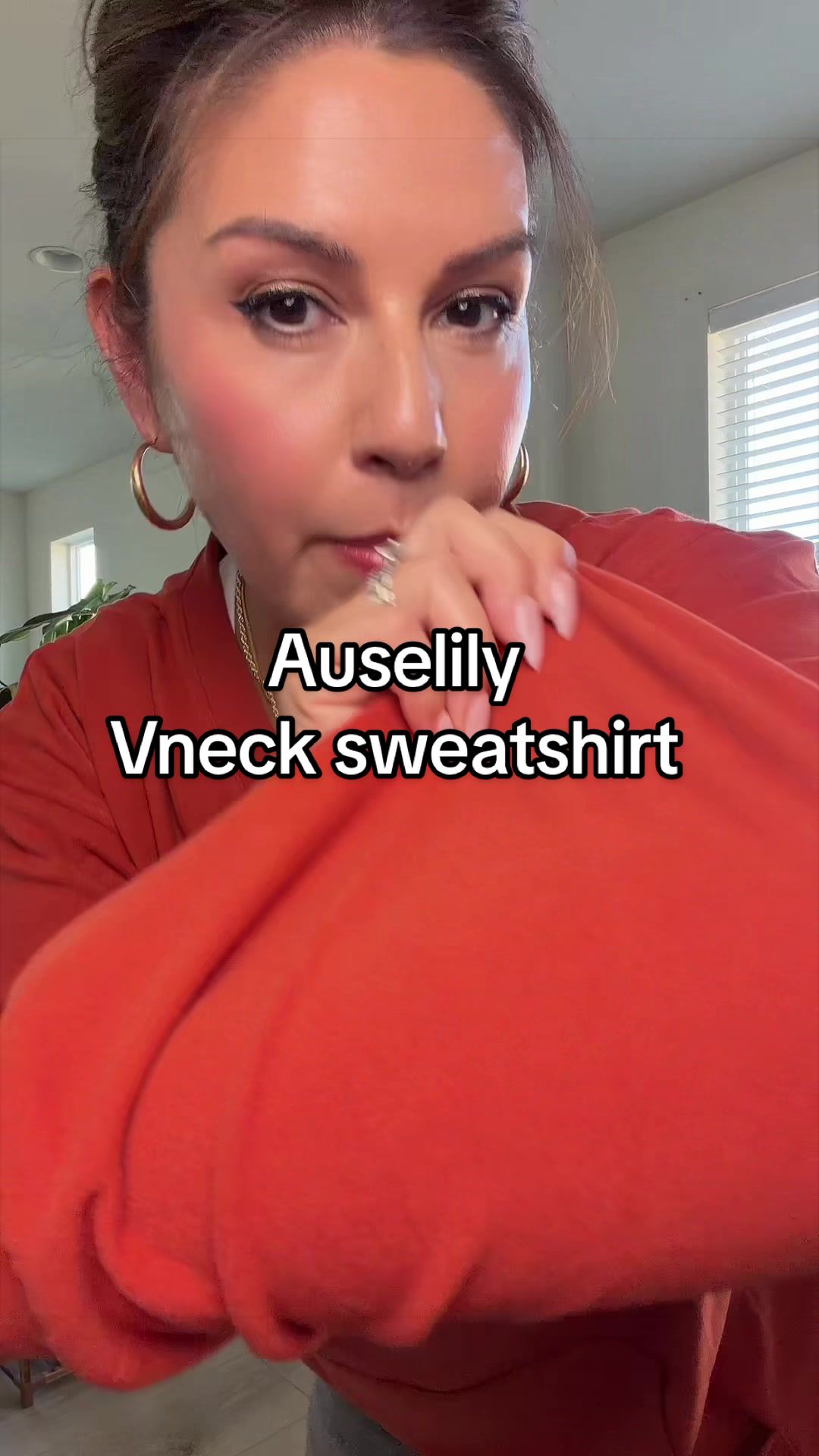 TikTok post by @anglee11 for AUSELILY. Caption reads: [...] for style. You need this sweatshirt....