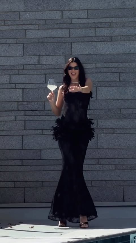Instagram post by @lyolya_marchenko for Sunfere. Caption reads: [...] wearing the Midnight Desire dress from....