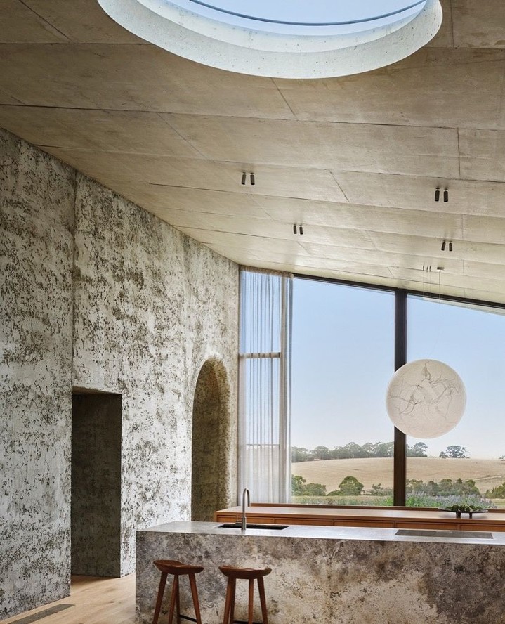 Instagram post by @lisacohenphoto for Interior Design. Caption reads: A 9,700-square-foot country house atop a summit in....